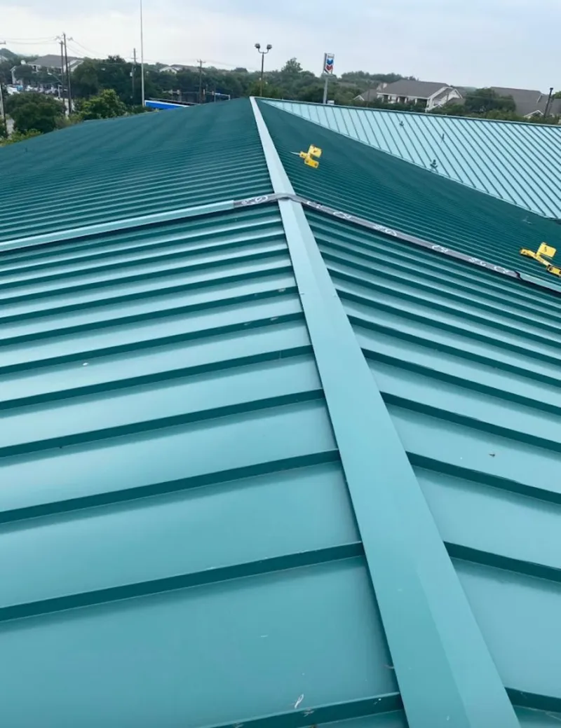 Green commercial metal roof ridge and valley for Metal Roof Repair in North Syracuse